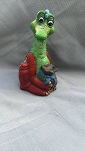 lot 888116 image: Hand-Painted Dragon Figurine Holding a Sack
