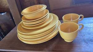 lot 6542 image: Fiesta Ware Yellow Gold Dinnerware Set