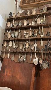lot 60622 image: Large Collection of Silver-Tone Souvenir and Decorative Spoons with Wooden Display Rack