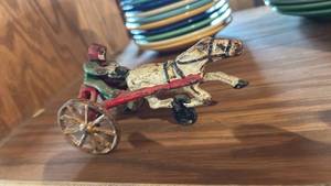 lot 60673 image: Cast Iron Horse and sulky Racing Toy