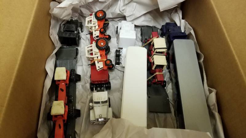 lot 1344 image: Large lot 164 Semis  Tractors  Flatbed  fuel hauler  Steelcase Furniture Semi
