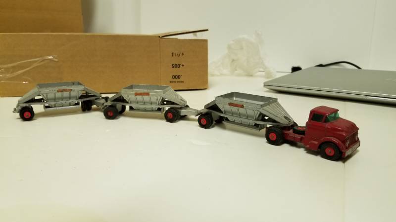 lot 1355 image: Old Cab and piggy back gravity trailers