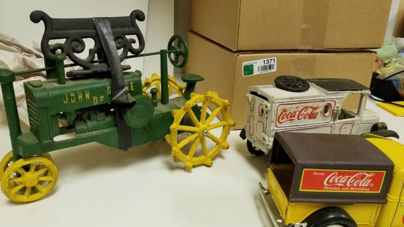 lot 1367 image: Cast iron John Deere and Coca Cola Toys
