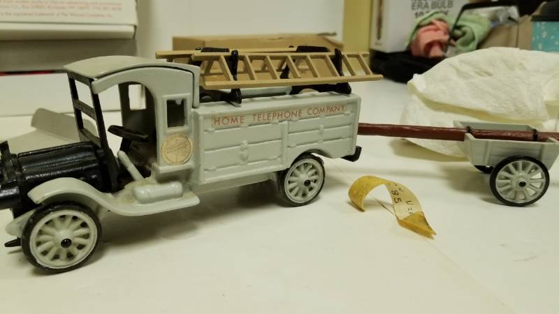 lot 1563 image: Super Cool cast iron telephone pole truck with pole trailer, never seen one before