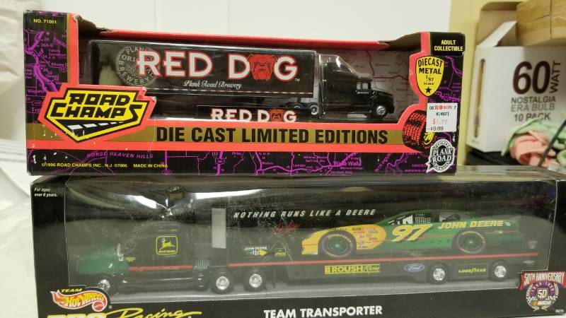 lot 1582 image: Red Dog Diecast and Hotwheels racing transporter