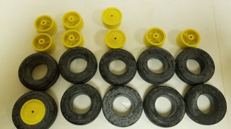 lot 1595 image: Set of rubber tires and inserts for your modeling needs, as pictured. each is around 1 12-2 tall
