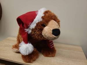 lot 42 image: Christmas Teddy Bear with Santa Hat and Scarf