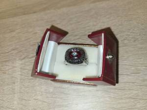 lot 46 image: 300 Bowling Ring with Red Gemstone in Display Box