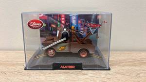lot 22 image: New old stock Disney Store Cars 2 Mater Die-Cast Figure in Display Case