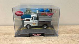 lot 23 image: New Old Stock Disney Store Cars Taco Truck Mater Die-Cast Vehicle in Display Case