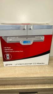 lot 34 image: New in box GPX Under Cabinet CD Radio with AMFM and Digital Clock (KC318S)