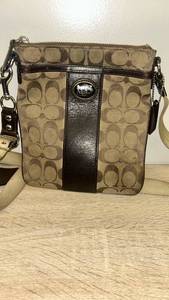 lot 48 image: Coach Signature Stripe Crossbody Swingpack Bag
