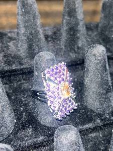 lot 70 image: Silver ring stamped .925 Cocktail Ring with Purple and Champagne Stones