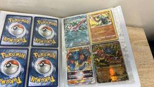 lot 125 image: Pokemon TCG Holofoil Card Collection Binder with GX, VSTAR & EX Cards