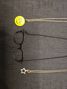 lot 50852 image: Fun Novelty Necklace Set - Smiley Face, Glasses Frame, and Star Pendant