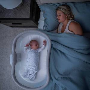 lot 1319 image: $350 HALO BassiNest Soothing Sleeper 3.0 Over-Bed Bassinet with 360  Rotation
