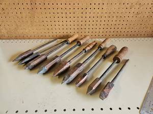 lot 5004 image: Lot of 9 antique soldering irons featuring copperheads, steel shanks, and wooden handles