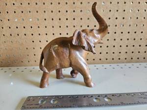 lot 5006 image: Carved Wood Elephant Figurine with Raised Trunk Decorative Accent