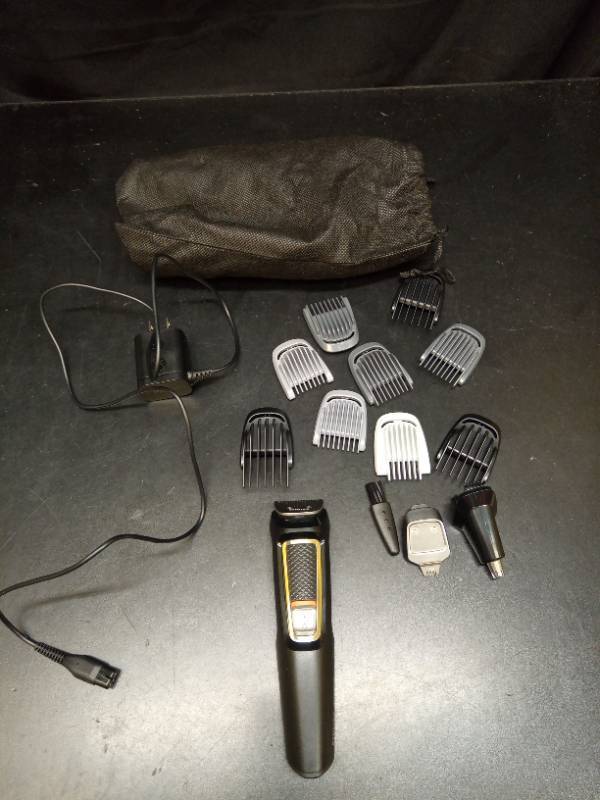 lot 2063 image: Philips Multi-Grooming Kit with Trimmer and Guard Combs - Retail $25