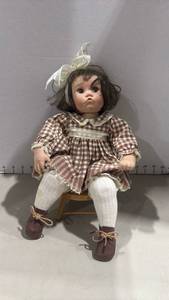 lot 1120 image: Porcelain Girl Doll with Pouting Expression and wooden stool