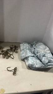 lot 1168 image: Shower curtain and rings