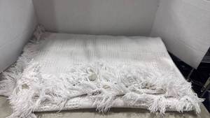 lot 1176 image: Crown Crafts Inc. White Woven Fringed Blanket Throw