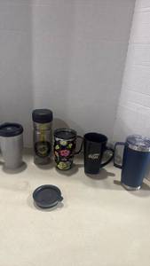 lot 1245 image: Wichita State Shockers and other drink-ware Collection