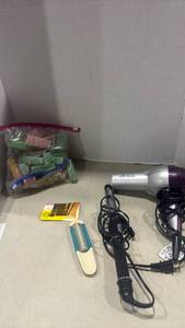 lot 1261 image: Revlon Ion Hair Dryer, Curling Iron, Hair Rollers and Accessories Bundle
