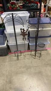 lot 1406 image: Metal free standing hose holder, dancing poodle Art and plant holder needs repaired