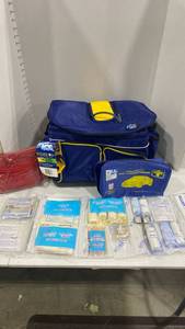lot 2097 image: Automotive first aid kit, rain poncho and folding cooler