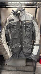 lot 100 image: Olympia Moto Sports armored riding jacket size large with riding pants