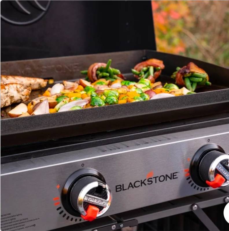 lot 20664 image: Blackstone 22-Inch 2-Burner Tabletop Griddle with Hood and Carry Bag - Retail $169