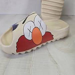 lot 61802 image: Elmo X Kaws Slides 35-36