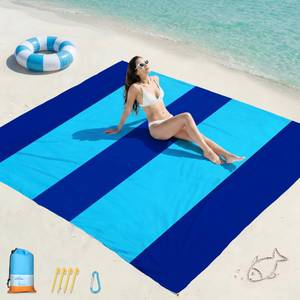lot 7049 image: Famstar Beach Blanket Oversized Extra Large 78 X 81,Waterproof Sandproof Beach Blanket 1-7 Adults Lightweight Durable for Travel Camping Hiking Picnic - Retail $17