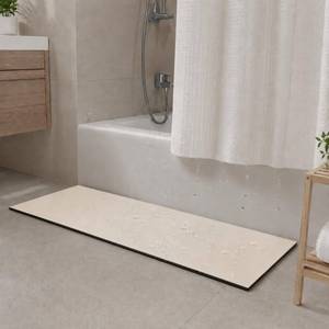 lot 13103 image: BANEBOR Super Absorbent Bath Mat for Shower & Tub, Bathroom Door Strip Runner, Under Shower Curtain Drip Rail, Non-Slip Floor Protector, Cut to Fit (Ivory, 31x12) - Retail $26