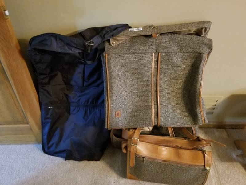 lot 5247 image: Two Suits Carrier Cases and One Carry On Travel Bag