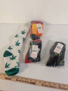 lot 223 image: Lot of 4 Pairs Assorted Socks - Leaf Pattern, Striped, and Graphic