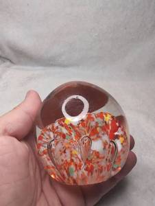 lot 2004 image: Glass Paperweight with Red and Orange Design