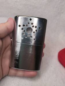 lot 3010 image: Metal Hand Warmer with Perforated Design