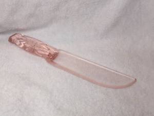 lot 4006 image: Pink Glass Butter Knife with Molded Floral Handle
