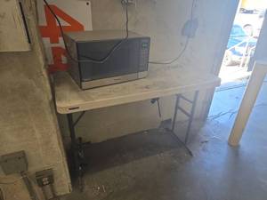 lot 181 image: Panasonic Inverter Sensor 1200W Microwave Oven and table