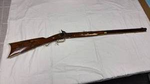 lot 17 image: Ardesa Spain .50 cal flintlock rifle with walnut stock embellishments include brass accents and coins