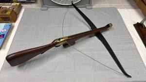 lot 48 image: Wood stock brass accent crossbow (no firing mechanism)
