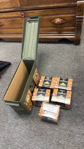 lot 135 image: Metal ammo can with .22 ammo (closed boxes are full boxes)