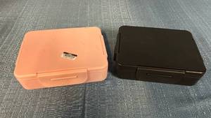 lot 8022 image: Set of 2 All In Motion Lunchboxes - One Light Pink in Color and The Second, Black in Color - Both Have Separate Compartments for Different Foods and Come with Small Side Sauce Container
