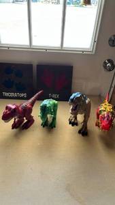 lot 18 image: Dinosaur Action Figure Collection with Decorative Wood Signs