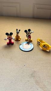 lot 23 image: Disney Mickey Mouse & Pluto PVC Figures with Walt Disney World Button Pin and Mickey wrist band lot.