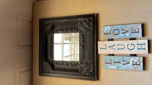 lot 25 image: Ornate Black Framed Wall Mirror with Love Laugh Live Wood Sign Set