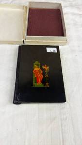 lot 56 image: Small Black Hardcover Book with Painted Figural Decoration in Presentation Box