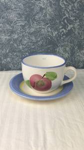 lot 124 image: Ceramic Teacup and Saucer Set with Apple Motif Blue Trim